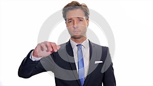 Worried businessman gesturing thumbs-down