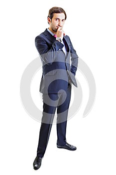 Worried businessman with hand on hip