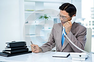 Worried businessman in the phone