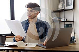 Worried Businessman Reading Papers Having Problem With Documents In Office