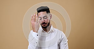 Worried businessman shaking his head