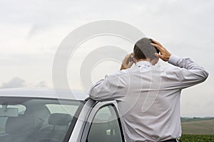 Worried businessman talking on cell phone