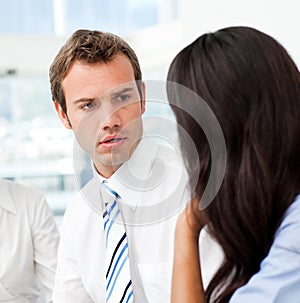 Worried businessman talking with his partner