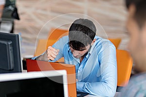 Worried businessman working at his desk in his office