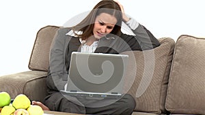 Worried businesswoman having made a mistake on the laptop