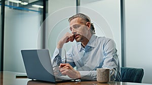 Worried ceo sitting workplace closeup. Stressed businessman getting bad news