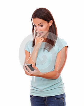 Worried charming woman reading a text