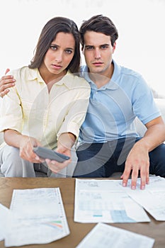 Worried couple doing their accounts