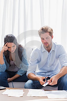 Worried couple doing their accounts together