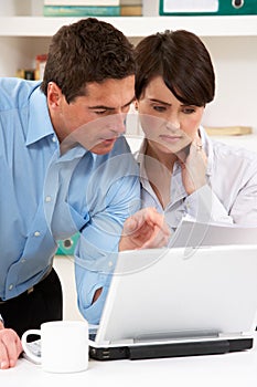 Worried Couple Working From Home