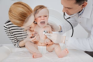 Worried expressive toddler looking terrified