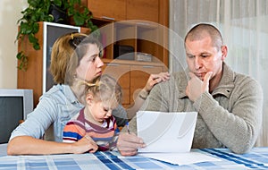 Worried family with financial documents