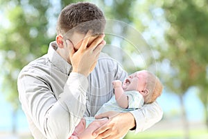 Worried father and baby crying