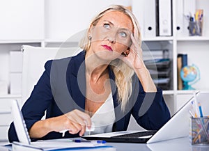 Worried female manager in office