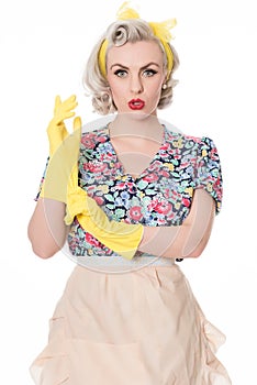 Worried fifties housewife with sink plunger, humorous concept, s