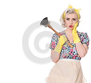 Worried fifties housewife with sink plunger, humorous concept, s photo