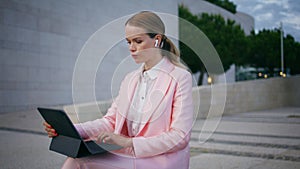 Worried freelancer working laptop sitting bench outdoors closeup. Business woman