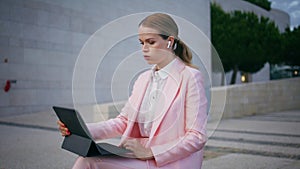 Worried freelancer working laptop sitting bench outdoors closeup. Business woman