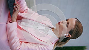 Worried freelancer working laptop sitting bench vertical closeup. Business woman