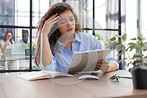 Worried frustrated businesswoman shocked by bad news, stressed businesswoman troubled with financial problem. Collegues