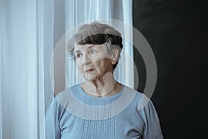 Worried grandmother with alzheimer`s disease