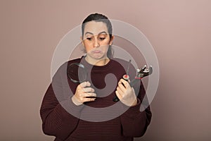 Worried helpless woman with tools