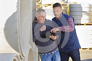 Worried home inspector holding clipboard outside