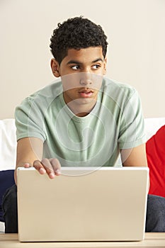 Worried Looking Boy Using Laptop