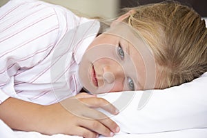 Worried Looking Young Girl In Bed