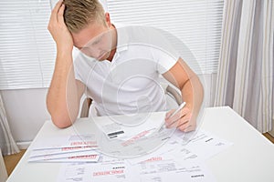 Worried Man Calculating Bills