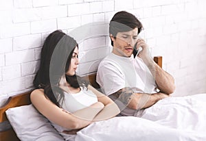 Worried man calling family counselor after quarrel with wife