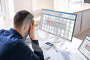 Worried Man At Computer With System Failure Screen