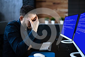 Worried Man At Computer With System Failure Screen