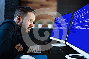 Worried Man At Computer With System Failure Screen