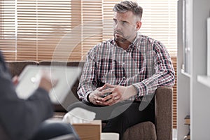 Worried man consulting marital problem