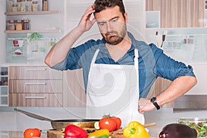 Worried man before cooking at home for dinner