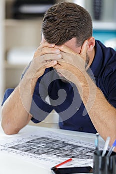 Worried man on desk