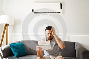 Worried man looking at his bills