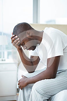 Worried man sitting on sofa