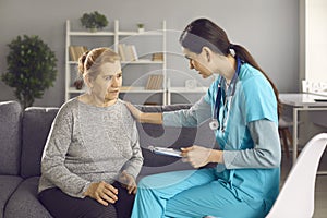 Worried mature woman talking to nurse or doctor who& x27;s comforting and supporting her