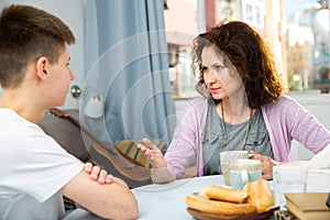 Worried mother talking to son