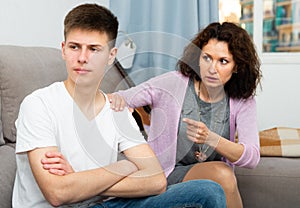 Worried mother talking to son