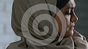 Worried muslim woman thinking of troubles, feeling despair and loneliness, shame