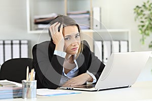 Worried office worker looking at camera