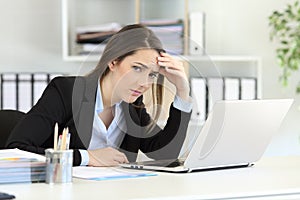 Worried office worker looking at camera