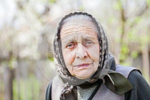 Worried old lady with headscarf