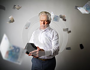 Old man in white and empty wallet. Falling Euro and taxes.