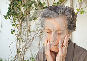 A worried old woman. Close up photo