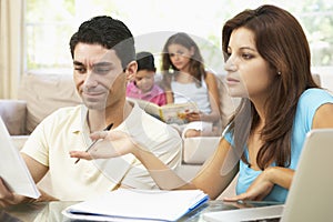 Worried Parents Using Laptop At Home photo