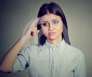 Worried pensive young woman thinking